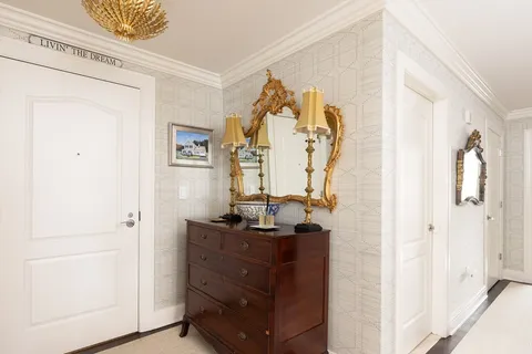 a view of a bathroom with a sink and mirror