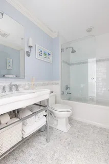 a view of walk in closet with cabinet