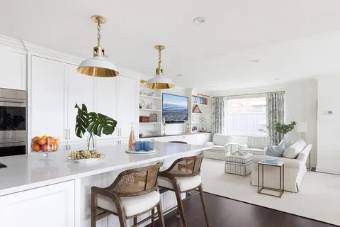 a very nice looking dining room with a table and chairs
