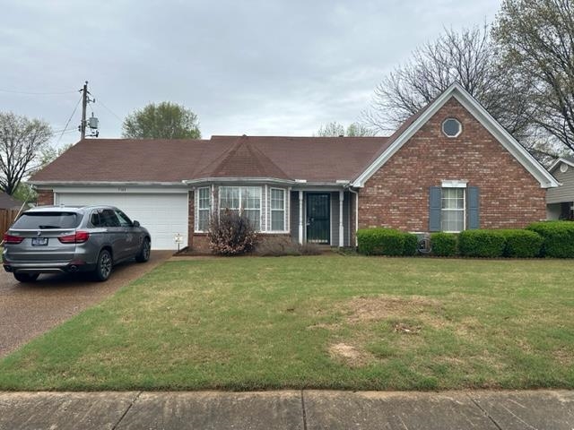 7764 Reese Road Memphis, TN 38133 - Photo 1 of 12 a front view of a house with a garden
