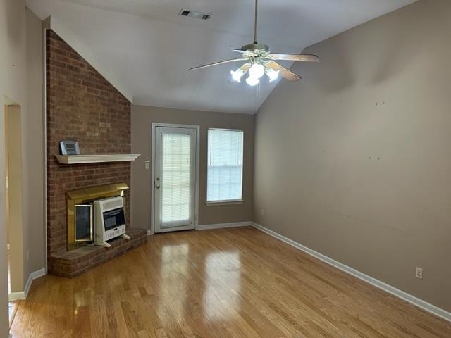 7764 Reese Road Memphis, TN 38133 - Photo 6 of 12 a view of an empty room with wooden floor fireplace and a window
