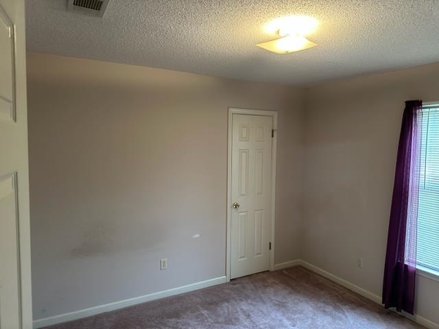 7764 Reese Road Memphis, TN 38133 - Photo 9 of 12 an empty room with a empty space and a window