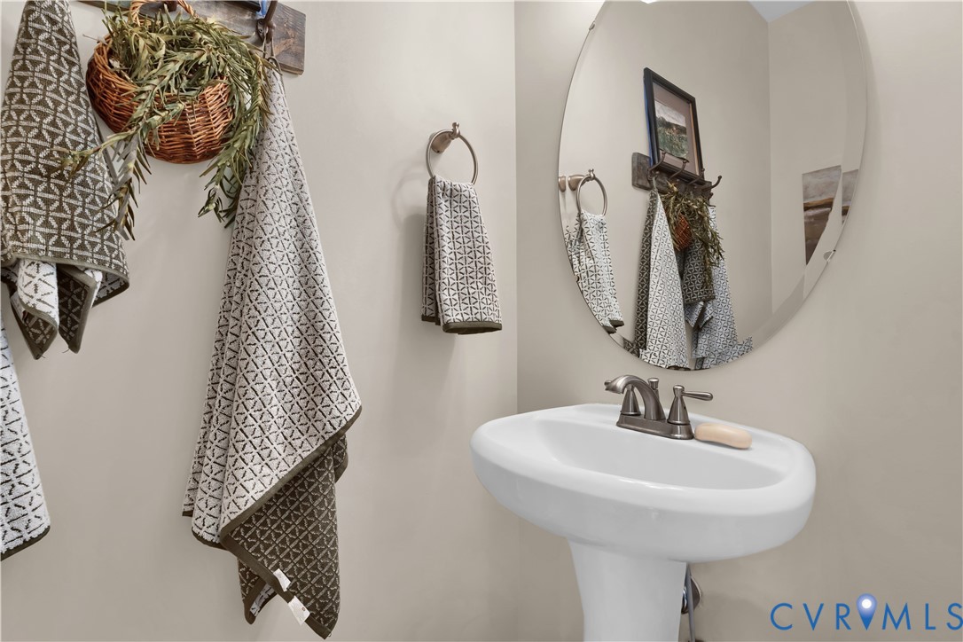 16148 Buckfast Place Beaverdam, VA 23015 - Photo 17 of 48 a bathroom with a sink and mirror