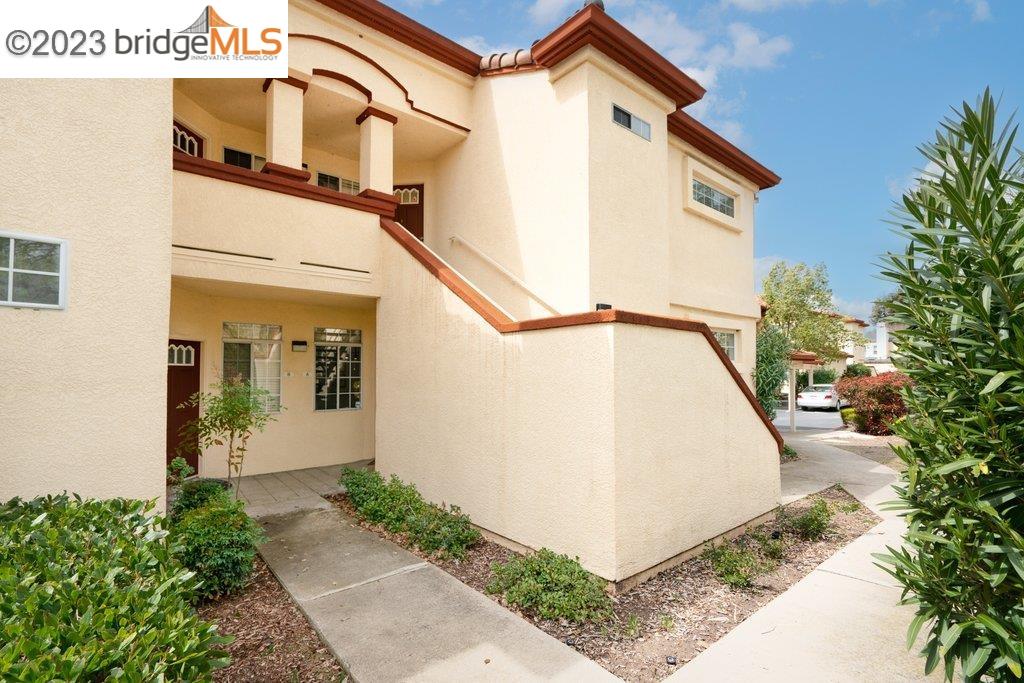 7003 Stagecoach Road, Unit A Dublin, CA 94568 - Photo 1 of 1 a view of a house with a small yard and plants