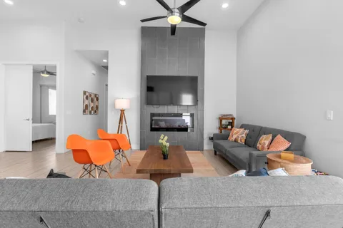 a living room with furniture and a fireplace
