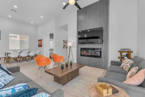 a living room with furniture and a fireplace