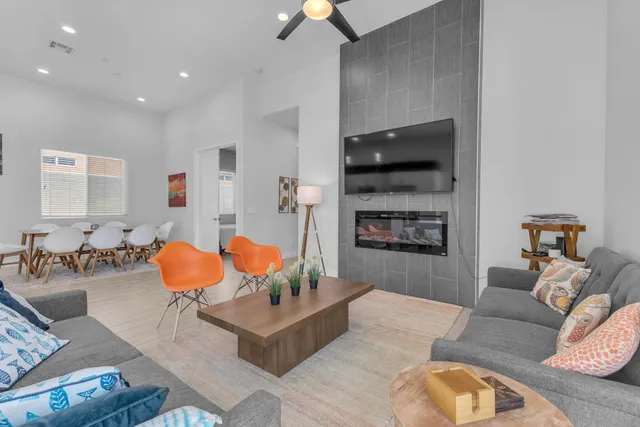 a living room with furniture and a fireplace