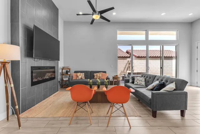 a living room with furniture and a large window