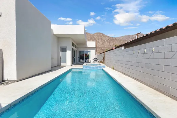 a view of a backyard with a patio