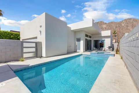 a view of a house with swimming pool