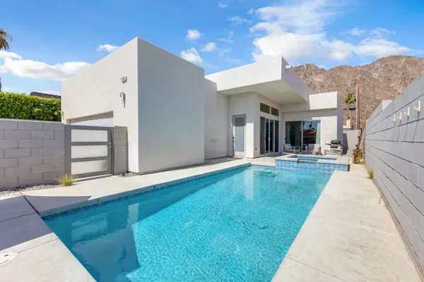 a view of a house with swimming pool
