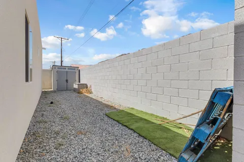 an aerial view of a house with swimming pool and red space