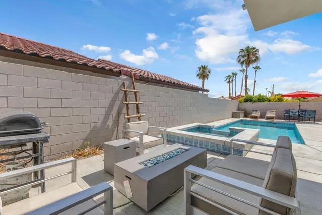 a kitchen with stainless steel appliances a sink stove refrigerator and cabinets