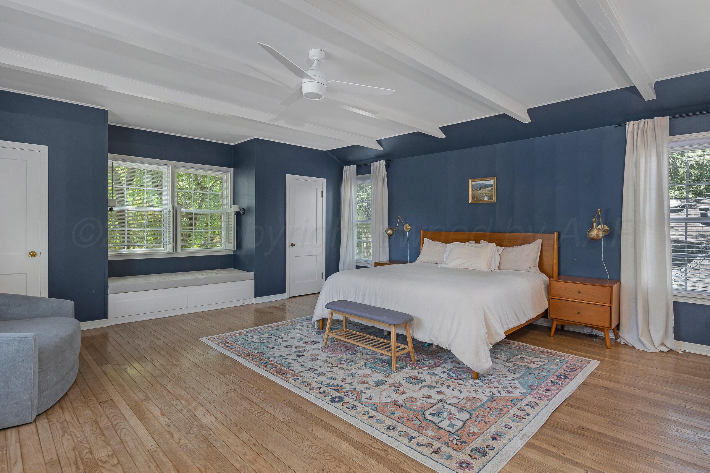 2102 South Hayden Street Amarillo, TX 79109 - Photo 25 of 44 a spacious bedroom with a large bed and a rug