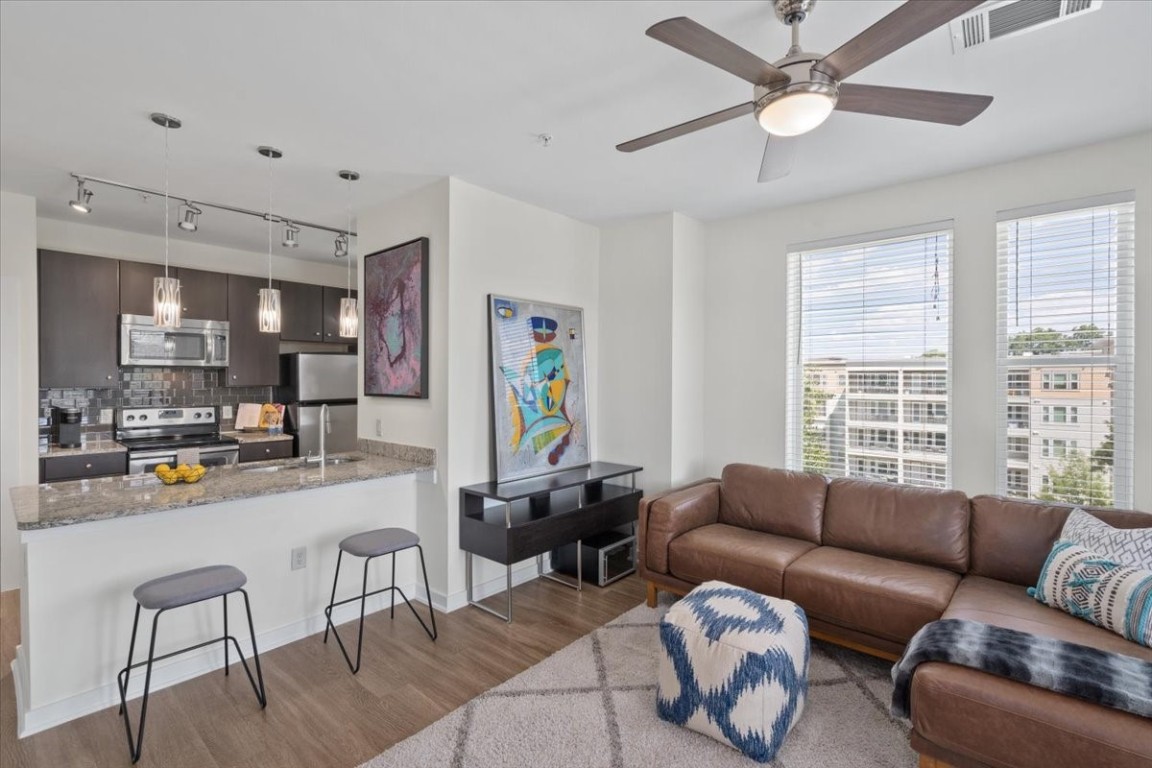 1900 Barton Springs Road, Unit 5001 Austin, TX 78704 - Photo 2 of 34 a living room with furniture and a large window