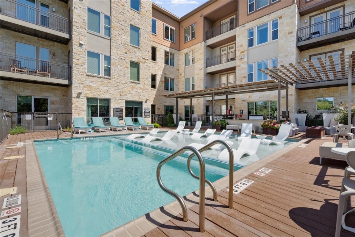 1900 Barton Springs Road, Unit 5001 Austin, TX 78704 - Photo 26 of 34 a view of a swimming pool with outdoor seating