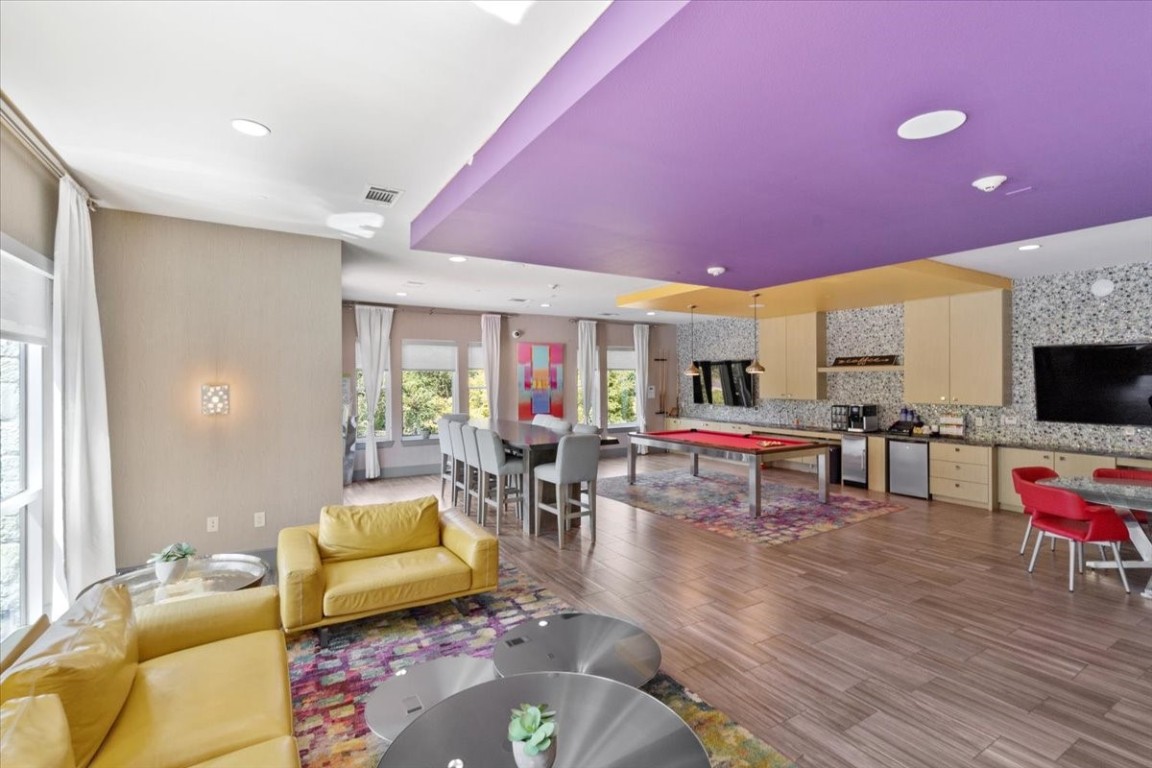 1900 Barton Springs Road, Unit 5001 Austin, TX 78704 - Photo 30 of 34 a living room with furniture and a flat screen tv