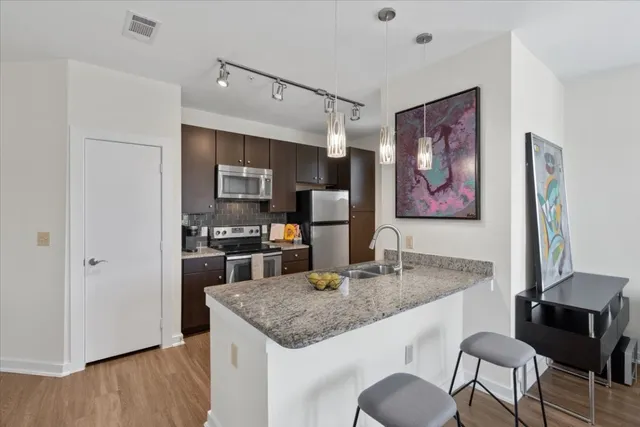 a kitchen with a stove microwave and refrigerator