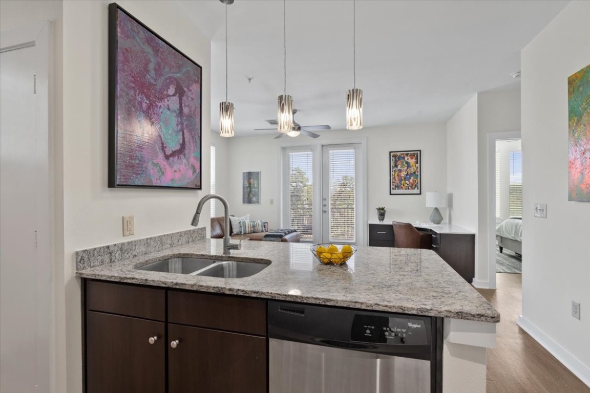 1900 Barton Springs Road, Unit 5001 Austin, TX 78704 - Photo 8 of 34 a view of a kitchen area with sink and wooden floor