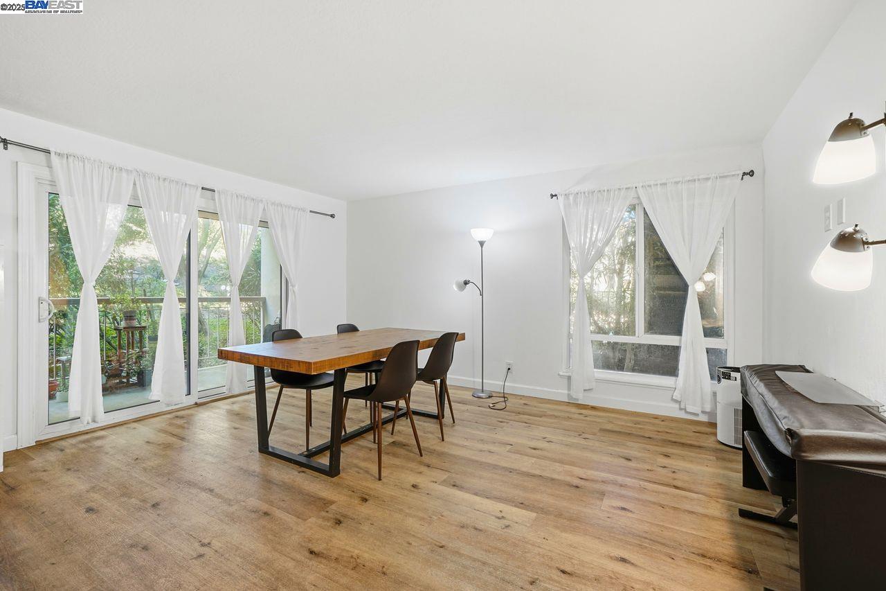 310 North Civic Drive, Unit 102 Walnut Creek, CA 94596 - Photo 1 of 39 a dining room with furniture and wooden floor