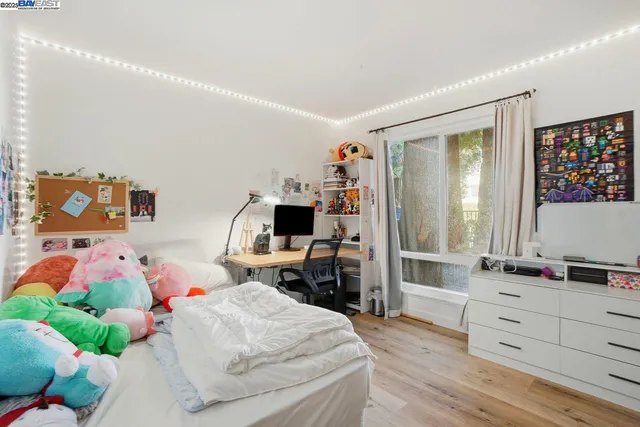 a bedroom with a bed and furniture