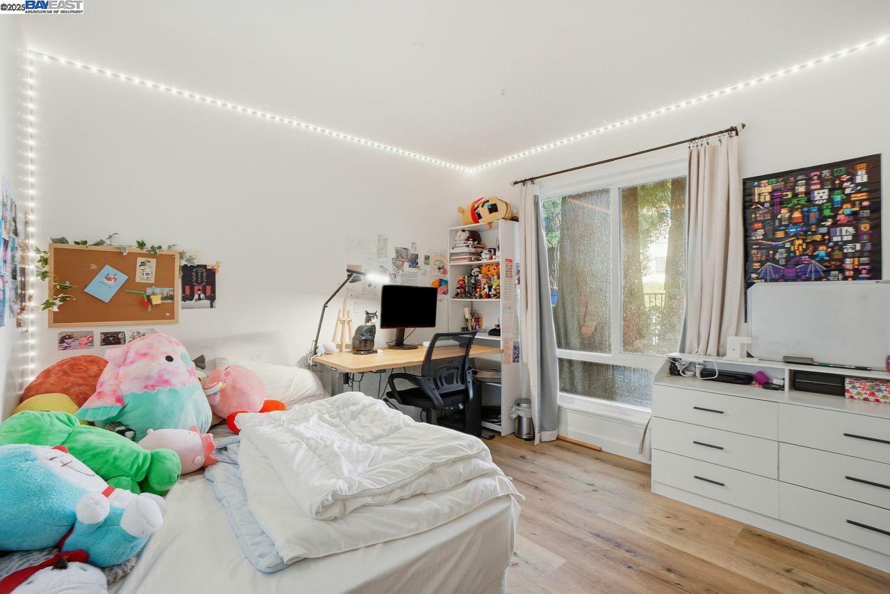 310 North Civic Drive, Unit 102 Walnut Creek, CA 94596 - Photo 11 of 39 a bedroom with a bed and furniture