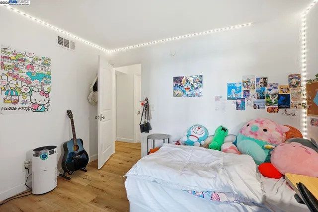 a bedroom with a bed and a couch