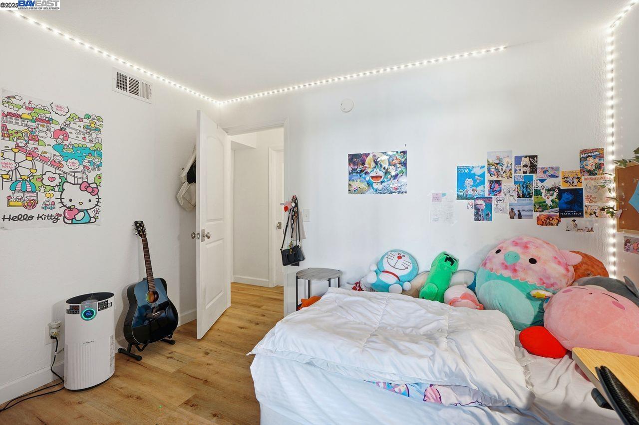 310 North Civic Drive, Unit 102 Walnut Creek, CA 94596 - Photo 12 of 39 a bedroom with a bed and a couch