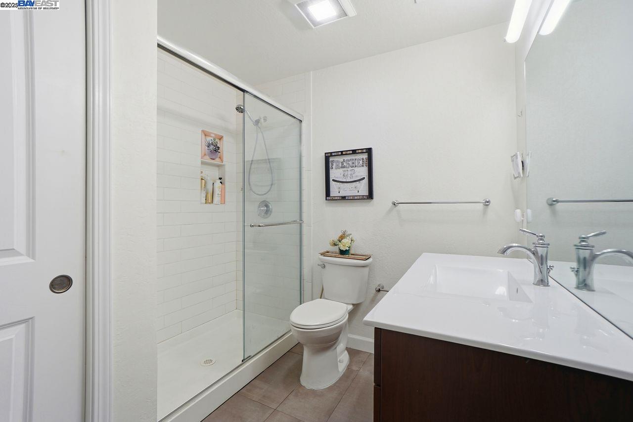 310 North Civic Drive, Unit 102 Walnut Creek, CA 94596 - Photo 13 of 39 a bathroom with a sink toilet and shower