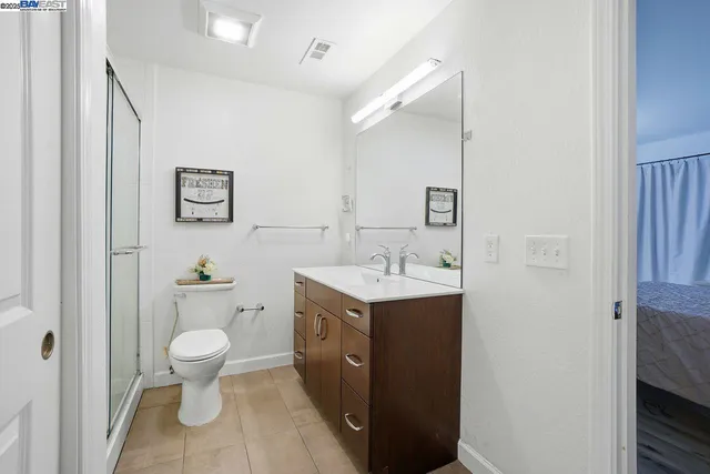 a view of bathroom with a sink toilet and vanity