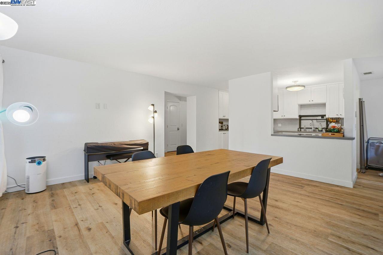 310 North Civic Drive, Unit 102 Walnut Creek, CA 94596 - Photo 2 of 39 a living room with dining room and wooden floor