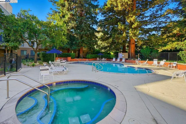a view of a swimming pool with a patio