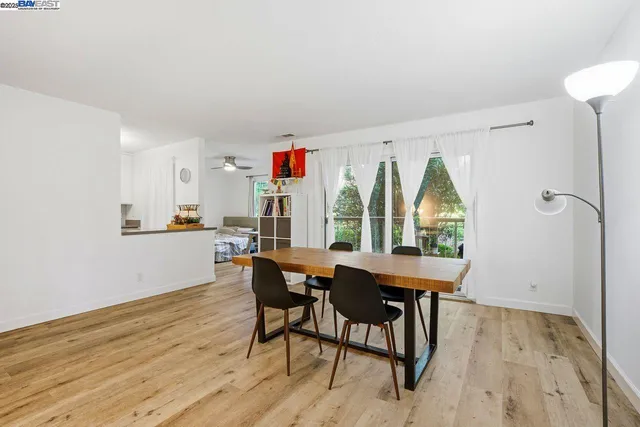a view of a dining room with furniture and a window