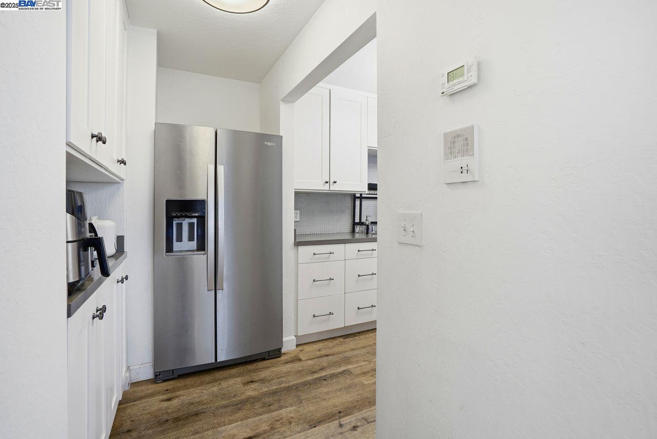 310 North Civic Drive, Unit 102 Walnut Creek, CA 94596 - Photo 36 of 39 a kitchen with cabinets and stainless steel appliances