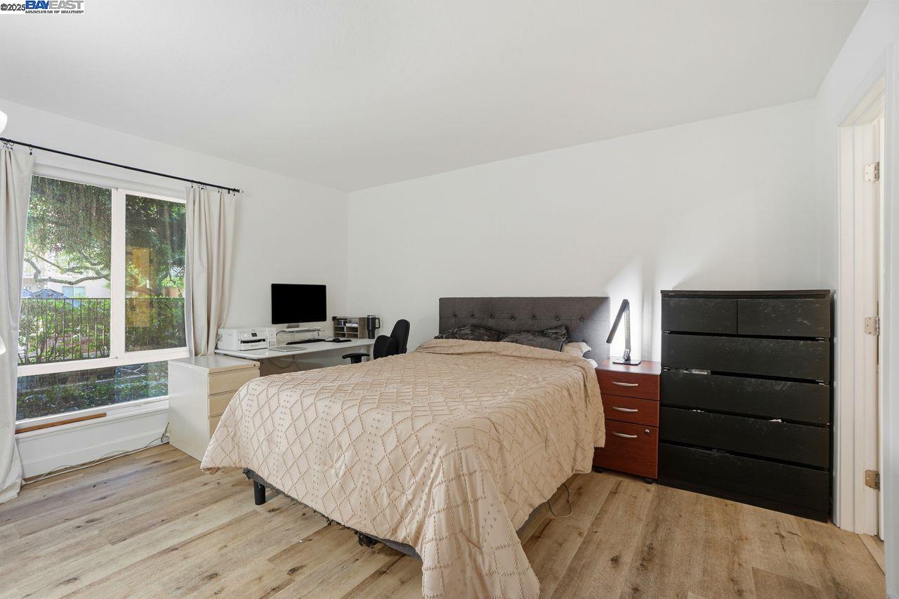 310 North Civic Drive, Unit 102 Walnut Creek, CA 94596 - Photo 5 of 39 a bedroom with a bed and a large window