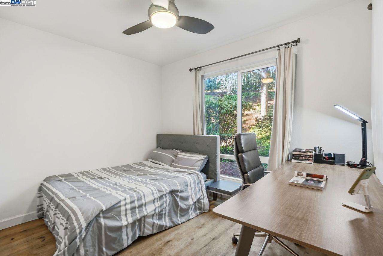 310 North Civic Drive, Unit 102 Walnut Creek, CA 94596 - Photo 8 of 39 a bedroom with a bed and a desk