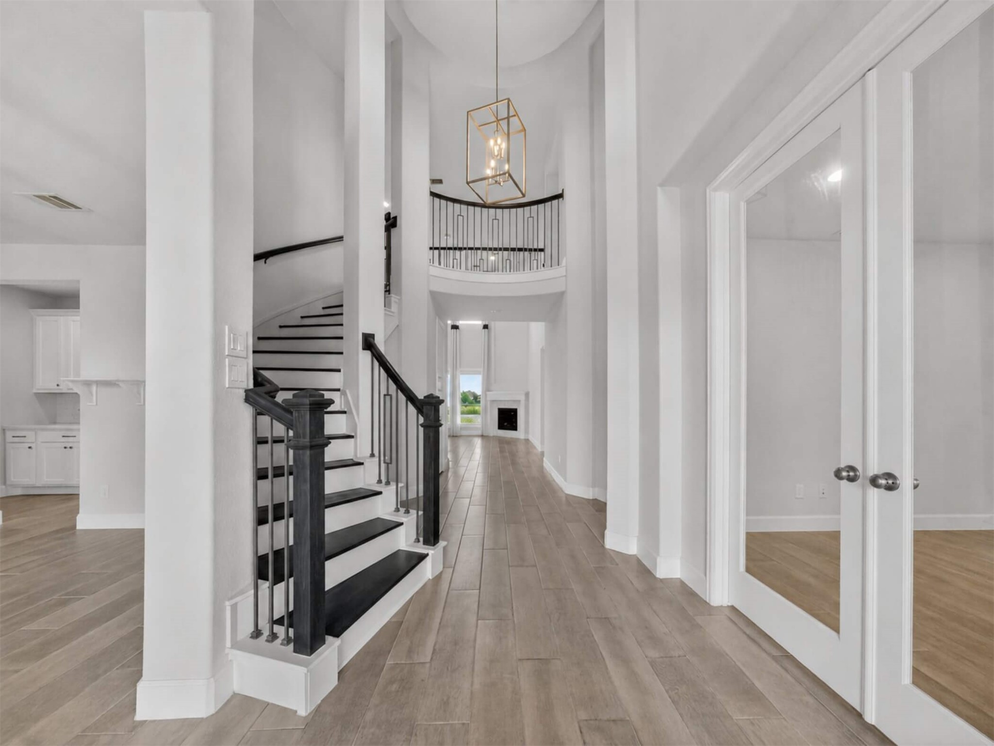 4343 Martin Ridge Drive Manvel, TX 77578 - Photo 6 of 50 a view of a hallway with wooden floor and entryway