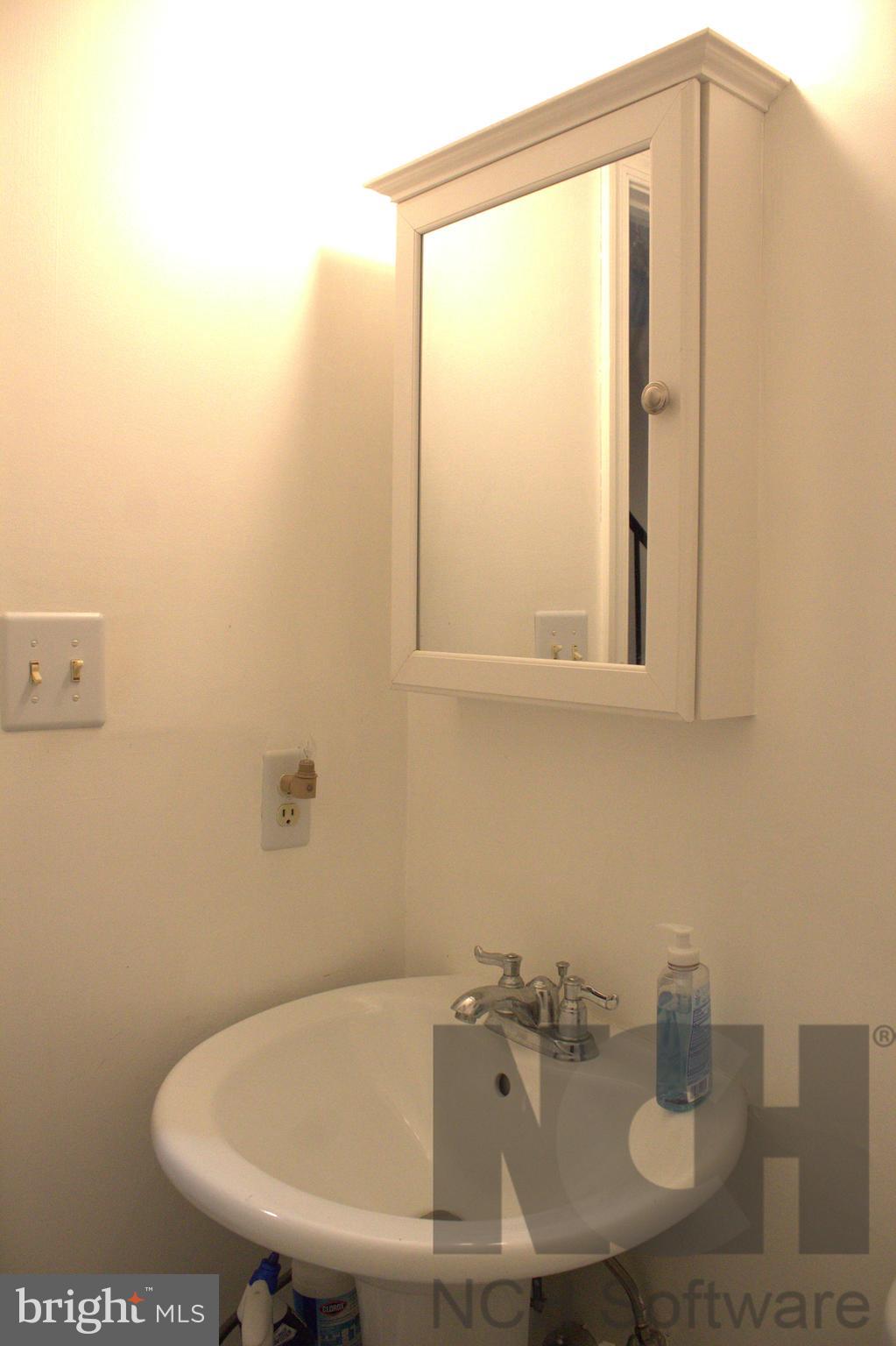 1902 Valley Terrace Southeast Washington, DC 20032 - Photo 20 of 33 a bathroom with a sink and a toilet