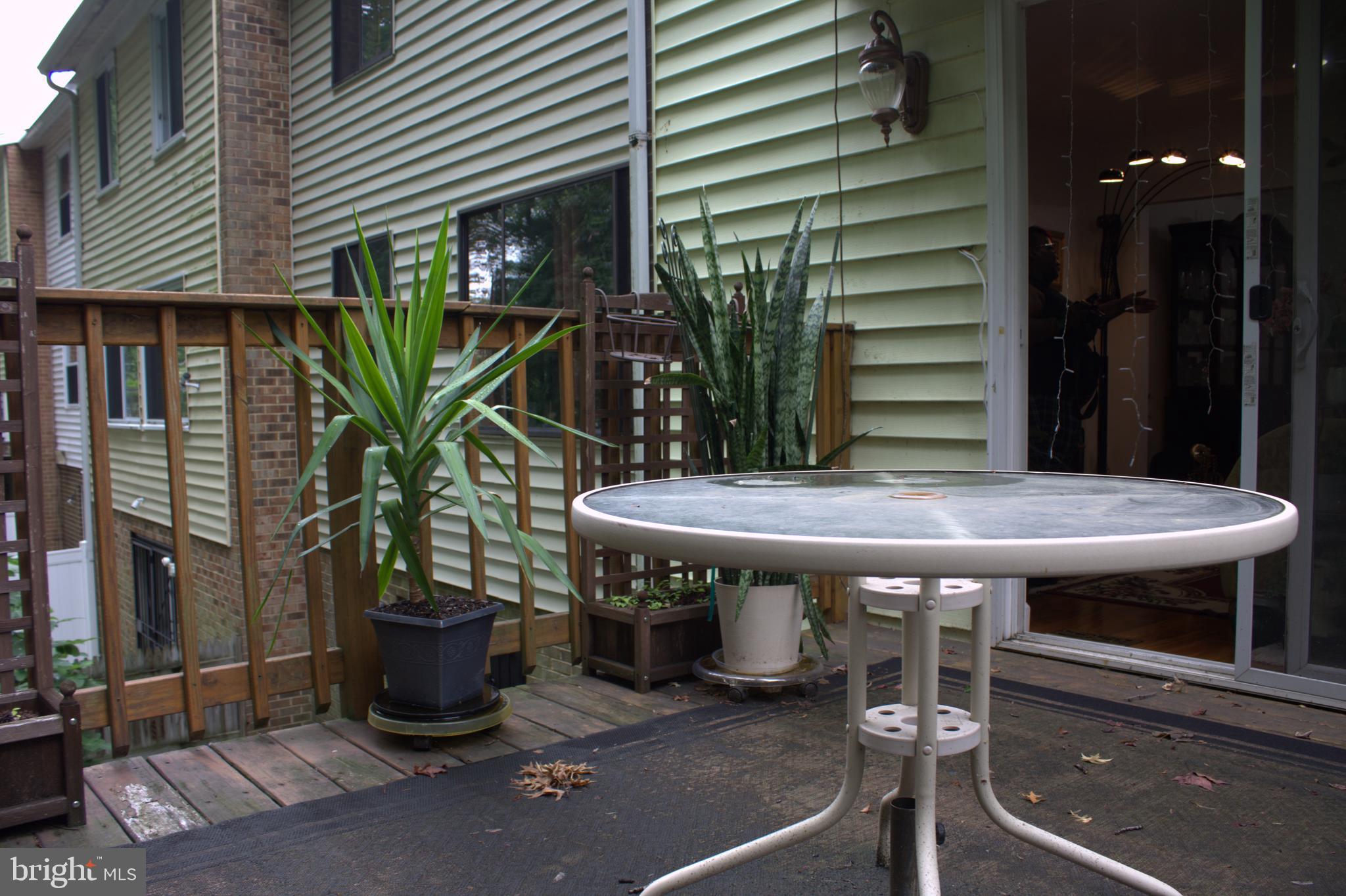 1902 Valley Terrace Southeast Washington, DC 20032 - Photo 29 of 33 a view of a dinning tables and chairs in patio