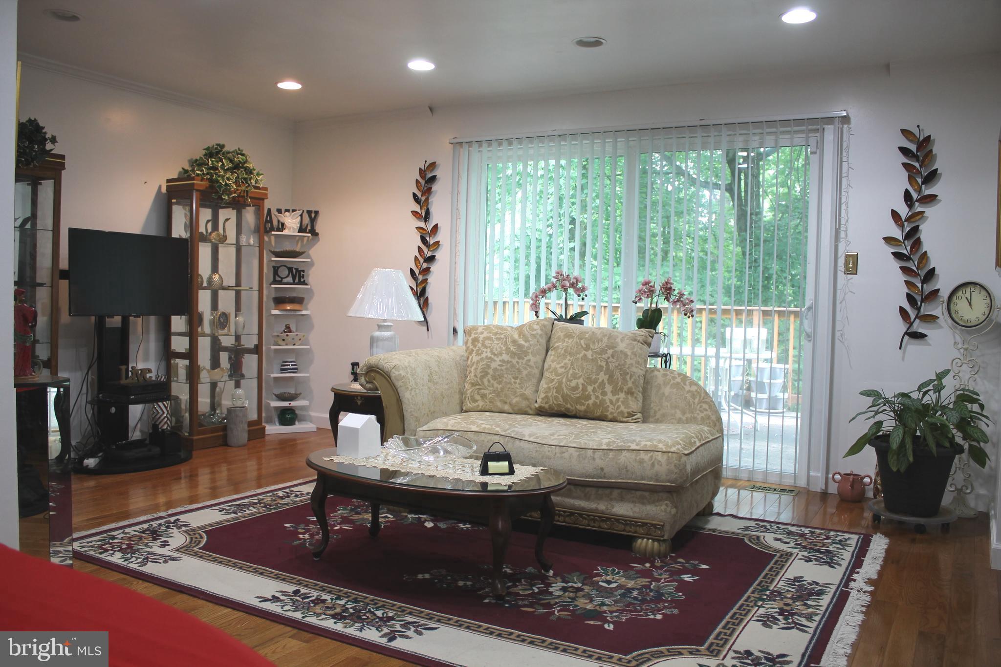 1902 Valley Terrace Southeast Washington, DC 20032 - Photo 8 of 33 a living room with furniture and a rug