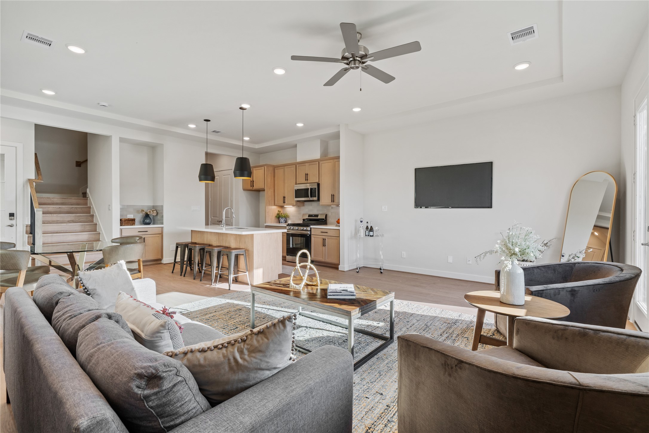 The living area sits open to the kitchen with no walls interrupting the view, so the whole floor feels larger than the square footage suggests.