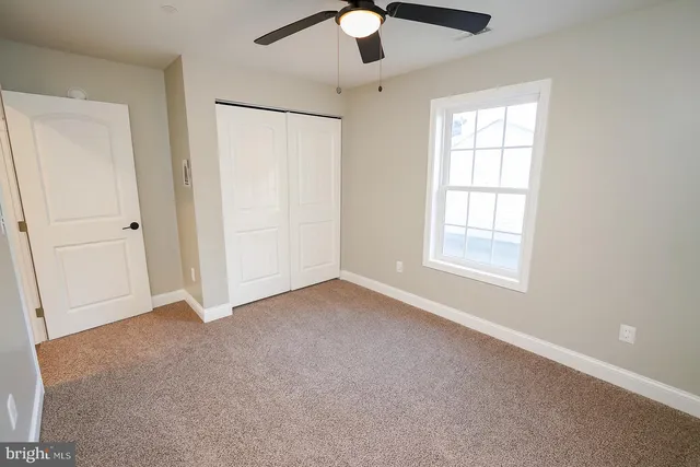 an empty room with fan