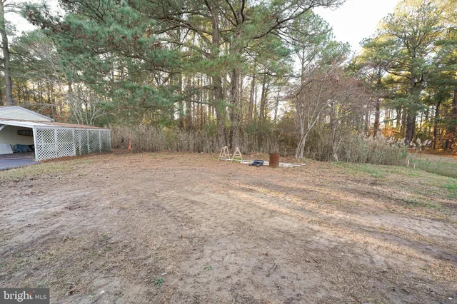 a front view of a house with wooden stairs