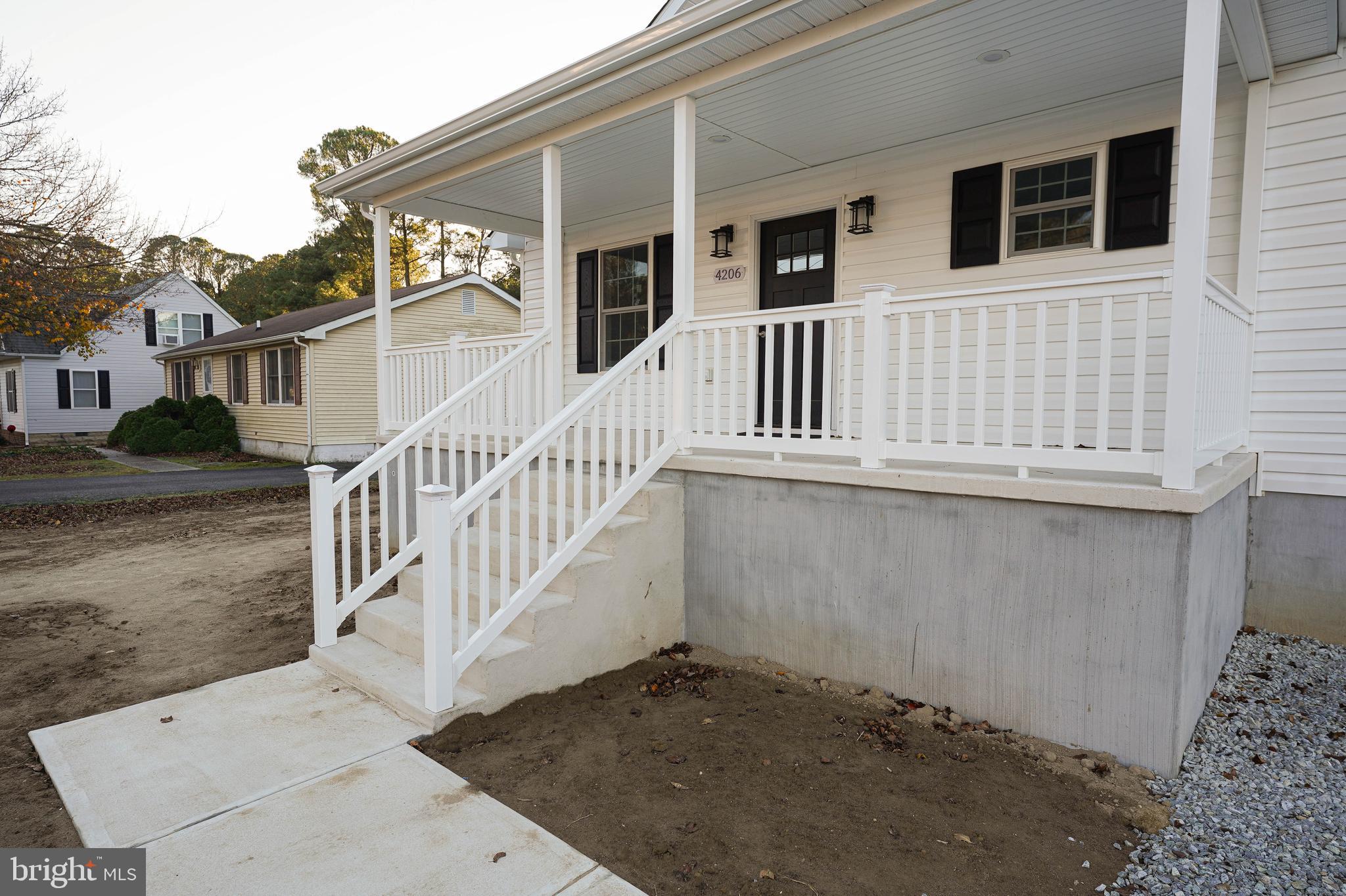 4206 Jacksonville Road Crisfield, MD 21817 - Photo 4 of 34 a view of a house with wooden fence