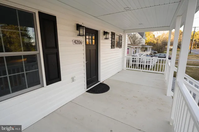 a view of balcony with floor to ceiling window and stairs