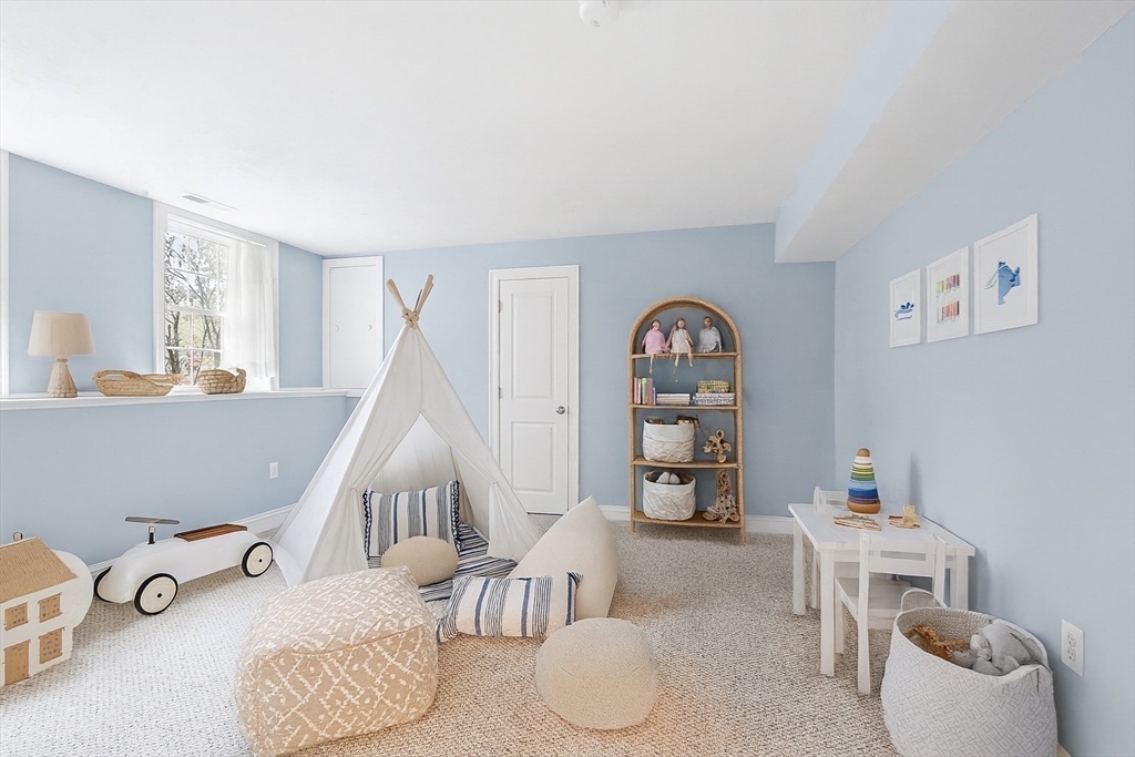 82 Littleton Road Ayer, MA 01432 - Photo 12 of 14 a room with furniture and a wooden floor