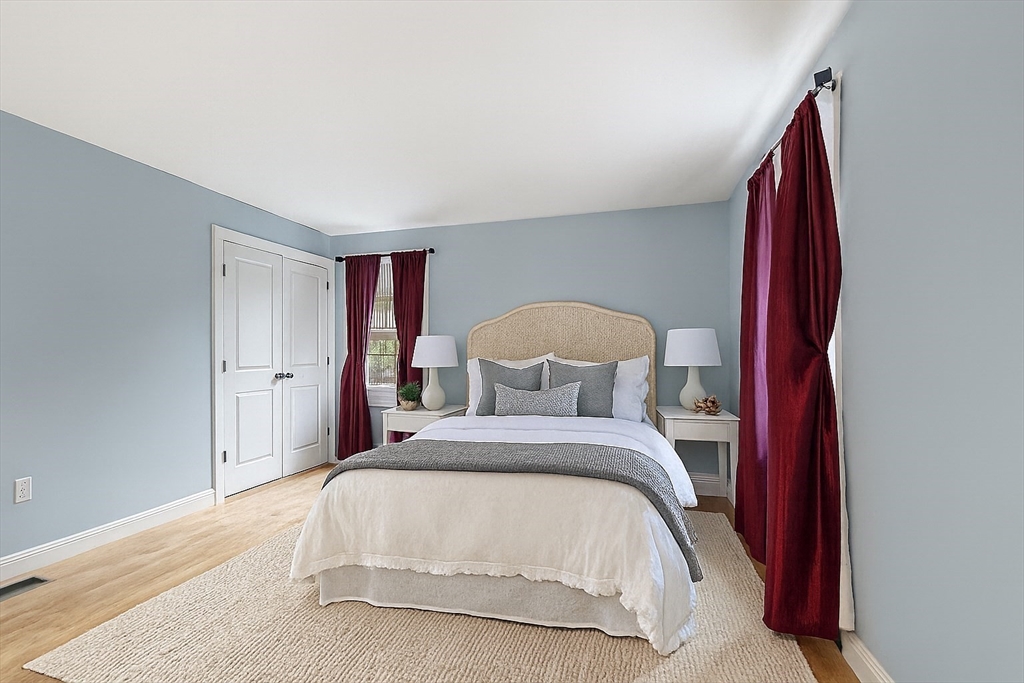 82 Littleton Road Ayer, MA 01432 - Photo 4 of 14 a bed room with a bed and a chair