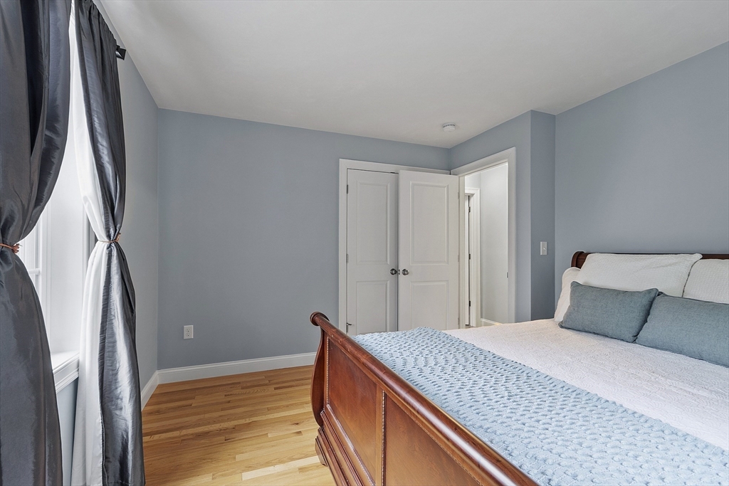 82 Littleton Road Ayer, MA 01432 - Photo 6 of 14 a bedroom with a bed and a refrigerator