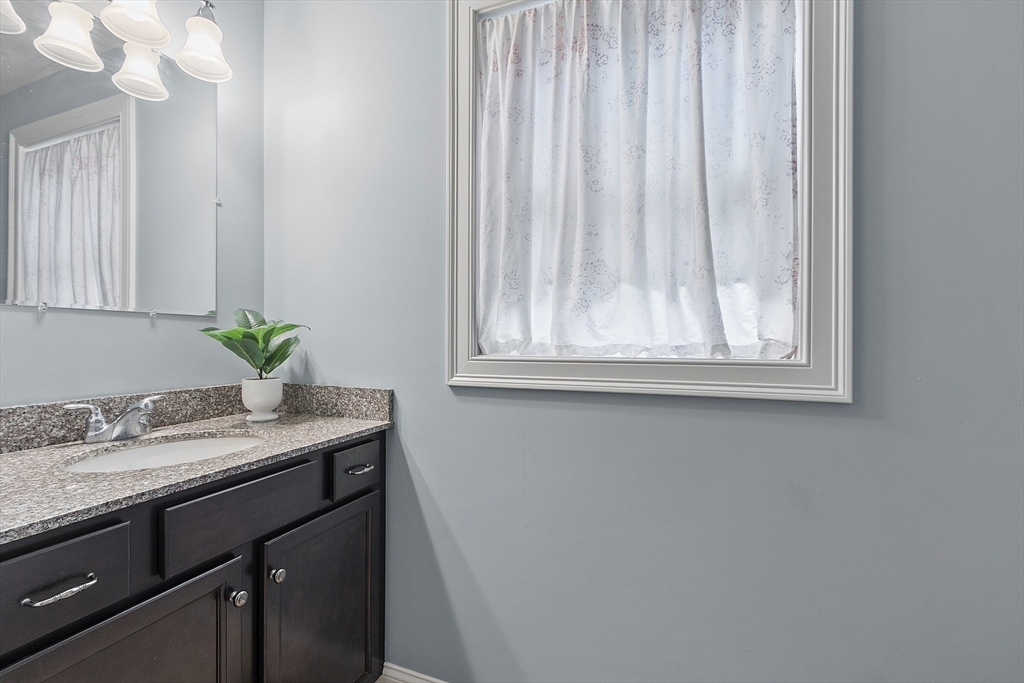 82 Littleton Road Ayer, MA 01432 - Photo 9 of 14 a sink with a mirror