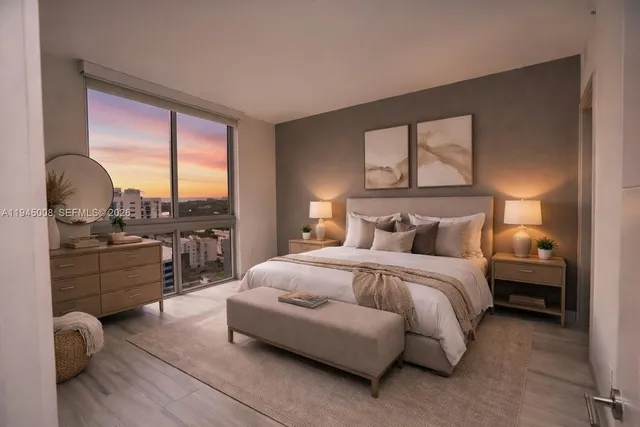 a bedroom with a bed and a large window